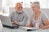 senior-people-using-laptop-smiling-20855479.jpg