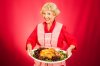 thanksgiving-dinner-grandma-sweet-grandmother-holding-beautifully-cooked-turkey-33996558.jpg