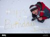 happy-birthday-written-in-the-snow-by-a-man-weeing-B85Y6M.jpg