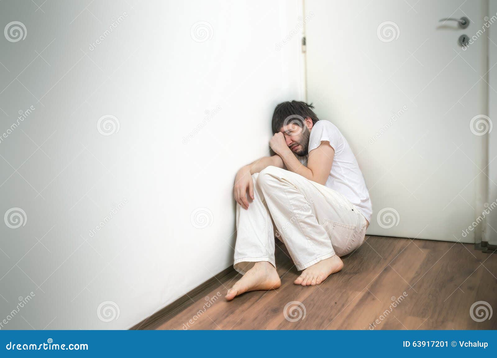 lonely-sad-man-suffers-depression-crying-floor-63917201.jpg