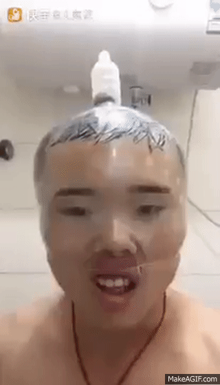 Man wears a condom on his head and inflates it on Make a GIF